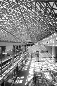 Grey Steel Frame Building Ceiling in Black and White Photograph during Daytime photo