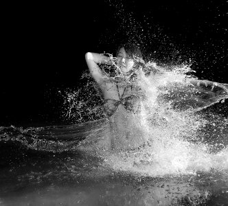 Woman in Bikini in Body of Water in Grayscale Photography photo