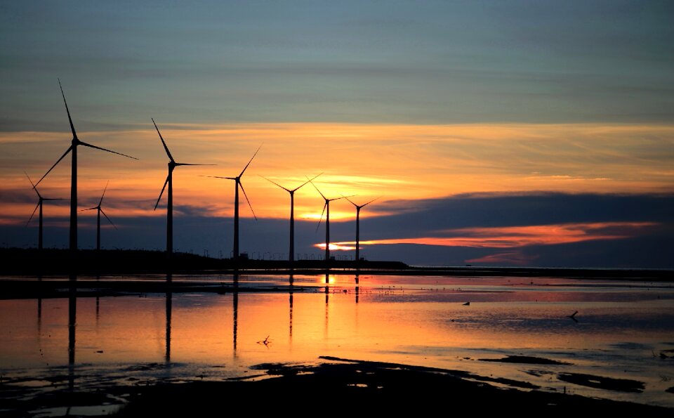 Silhouette Photo of Wind Energys during Golden Hour