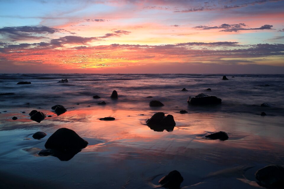 Stones on Body of Water during Golden Hour photo