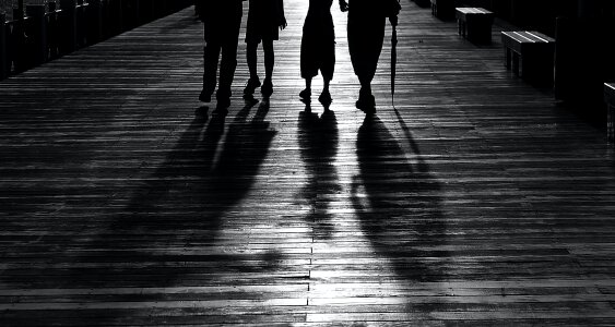 Silhouette of 4 Person Walking photo