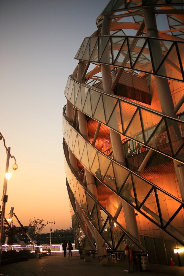 2 Person Walking Beside Dome Shape Designers Building photo