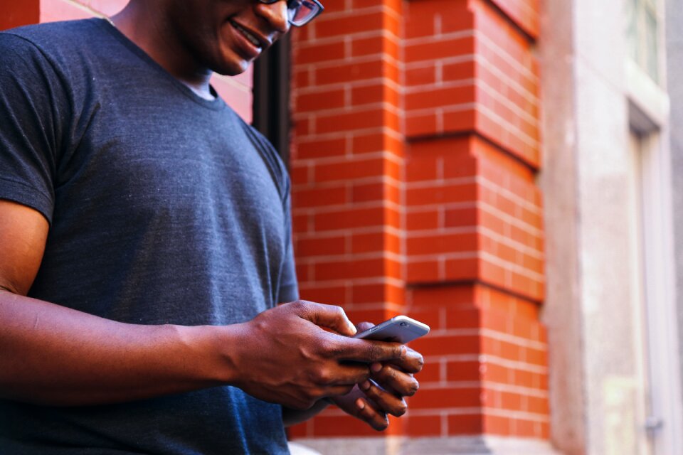 Man Using Gray Iphone 6 photo