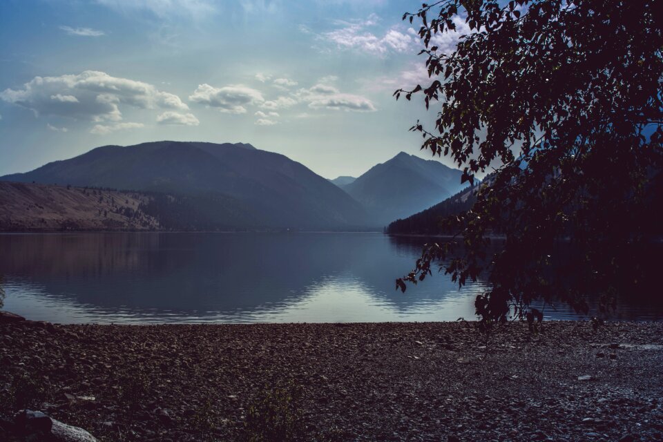Calm Body of Water Near Mountain