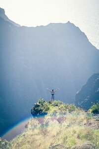 Man Standing on Cliff photo
