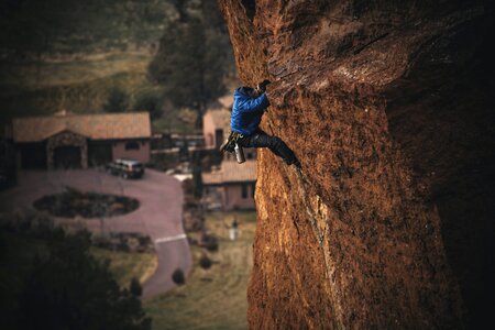 Man Rock Climbing on Cliff