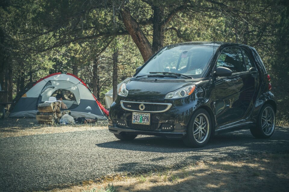Black Smart for Two Car on Gray Pavement
