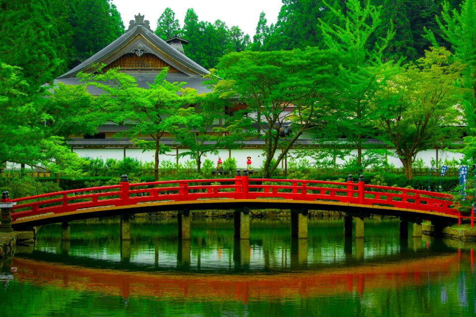 Red and Beige Wooden Arch Bridge