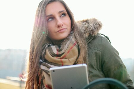 Woman Holding Silver Ipad photo