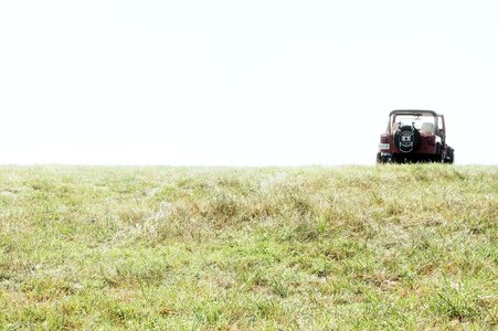 Tractor on Field Against Sky photo