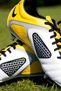 Pair of White-yellow-and-gray Soccer Cleats photo