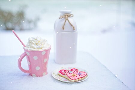 Pink and White Polkadot Ceramic Mug on the Table photo