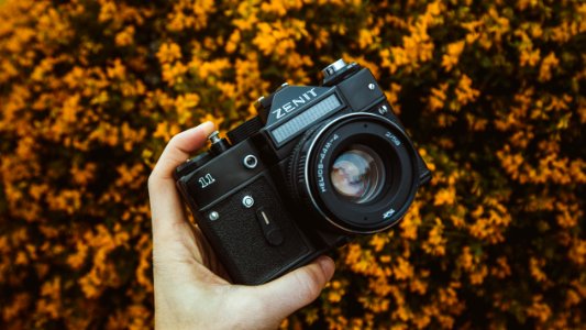 Person Holding Zenit Dslr Camera photo