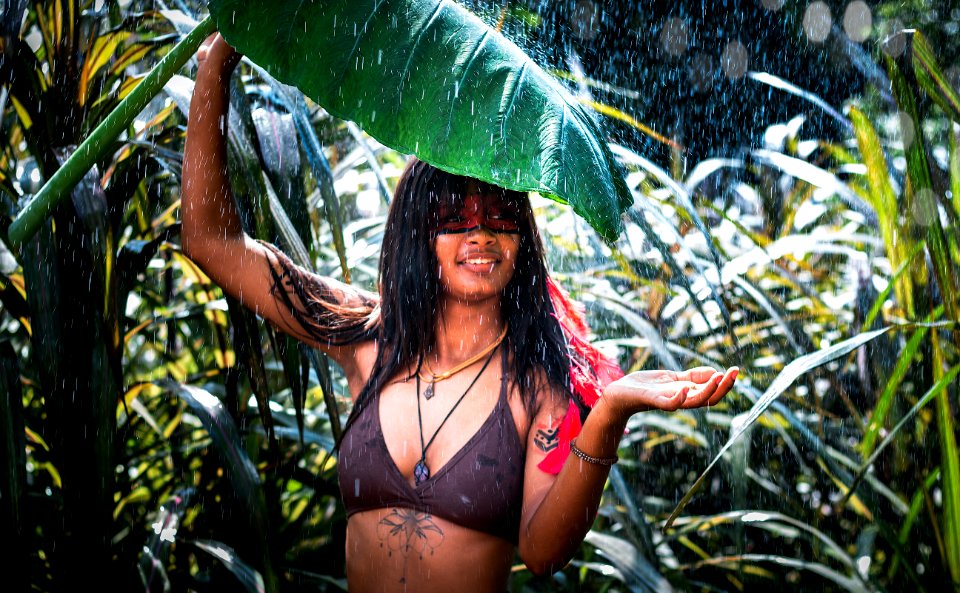 Woman In Black Bra Holding Big Leaf