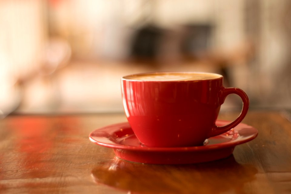 Red Ceramic Mug On Red Saucer