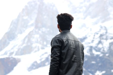 Man Wearing Black Jacket Looking At A Mountain photo