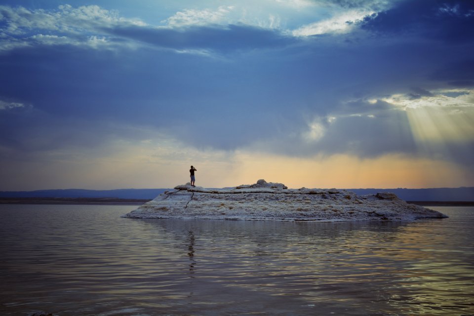 Person On Island During Sunset