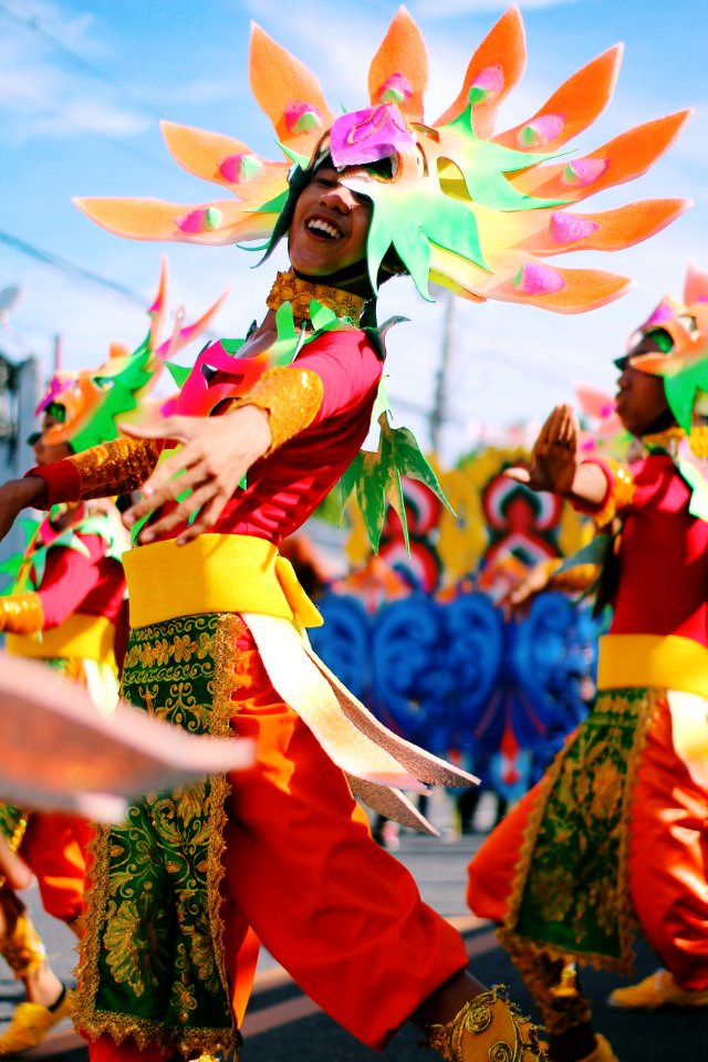 Shallow Focus Photography Of Person Wearing Multicolored Costume