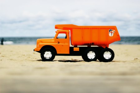 Photo Of Orange Dump Truck Toy photo