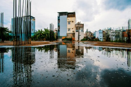 Body Of Water Near Concrete Buildings