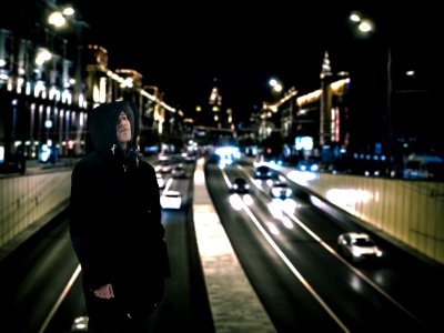 Man Wearing Black Hoodie With Road Background photo