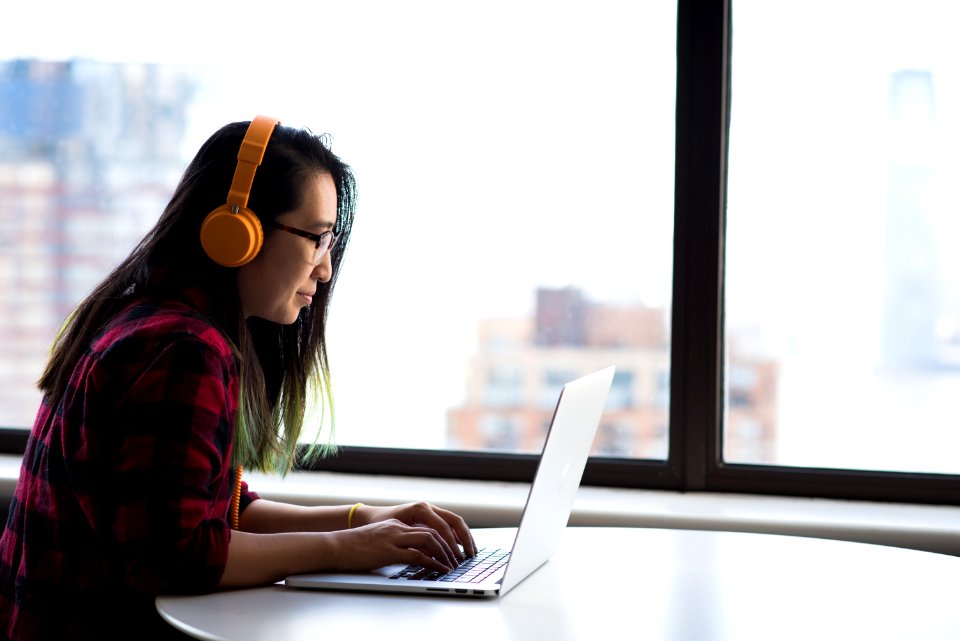 Photography Of Woman Using Laptop