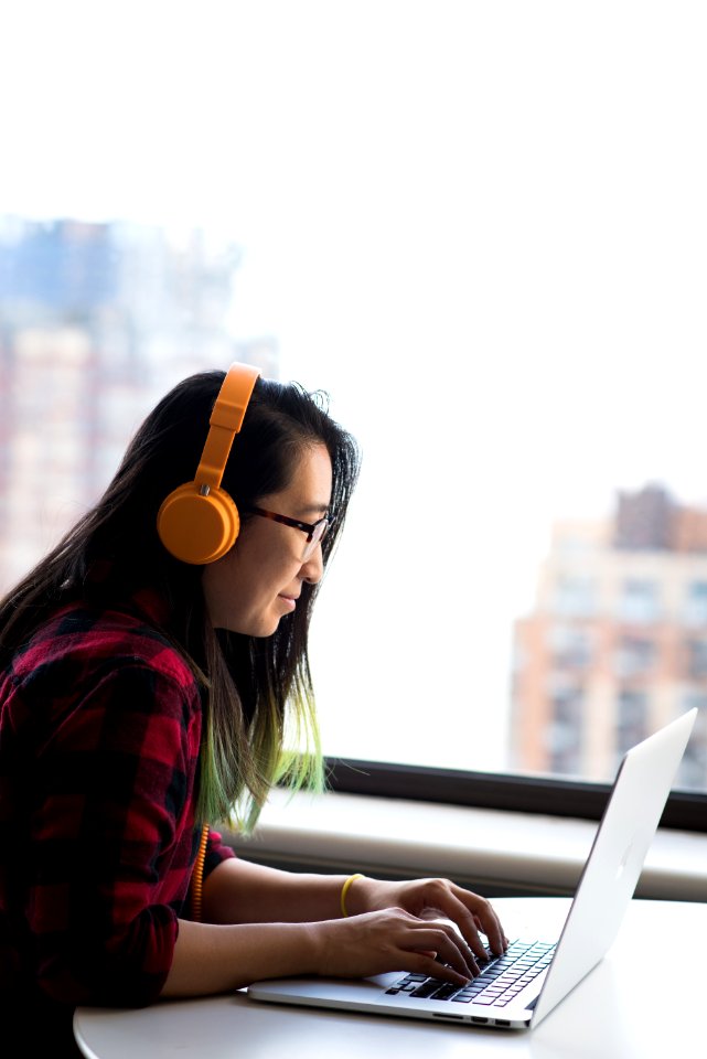 Photography Of Woman Using Laptop