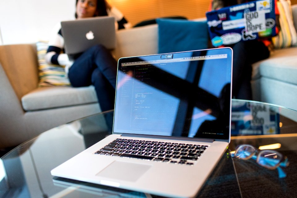 Closeup Photo Of Silver Macbook Pro On Table