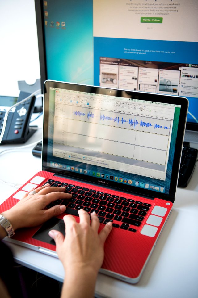 Persons Hands On Turned On Macbook Pro