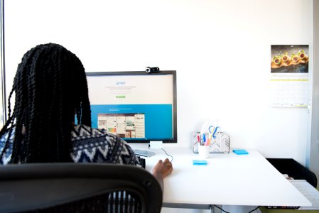 Woman Sitting On Chair Using Computer photo