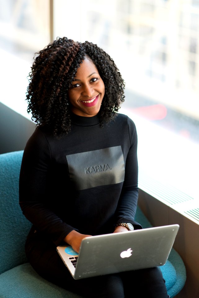 Woman Wearing Black Sweatshirt Using Silver Macbook