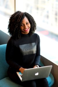 Woman Wearing Black Sweatshirt Using Silver Macbook