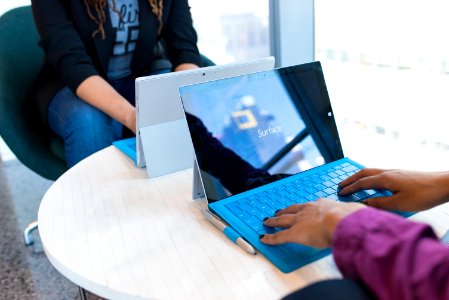 Person Using Microsoft Windows 3 On Table photo