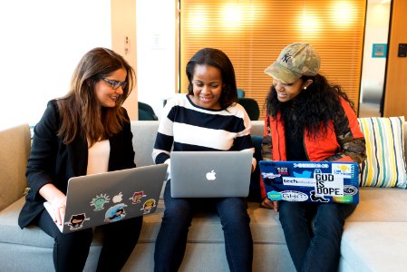 Three Woman In Front Of Laptop Computer