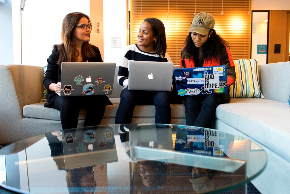 Woman Holding Macbook Pro