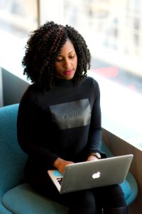 Woman In Black Long-sleeved Shirt Using Laptop photo