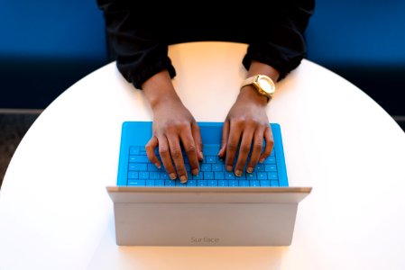 Person Typing On A Laptop photo