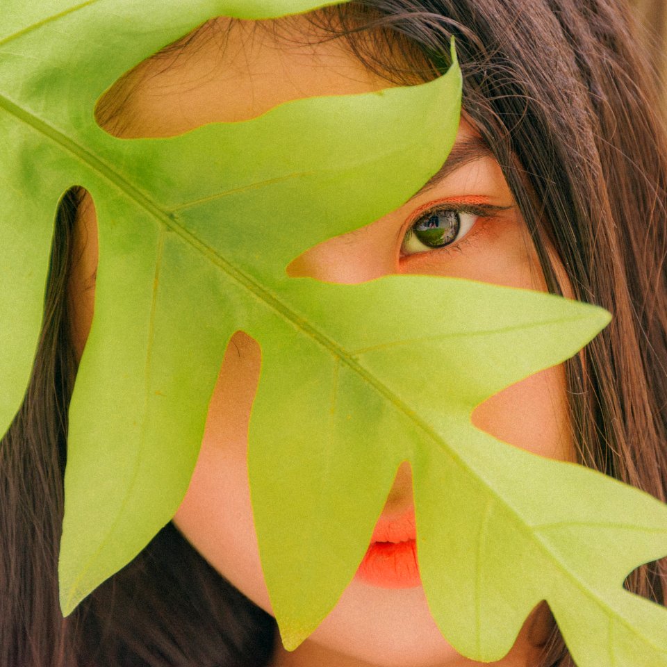 Photography Of Woman Near Leaf