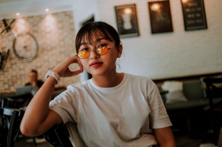 Woman Sitting Wearing Sunglasses