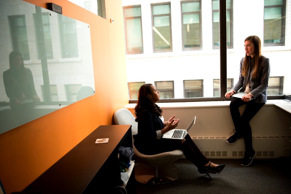 Woman Sitting In Chair Near Board