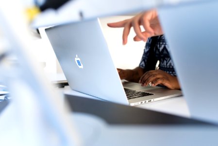 Persons Fingers Pointing In Macbook Pro