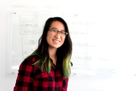 Woman Standing In Front Of Whiteboard photo