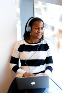 Photography Of Woman Listening To Music photo