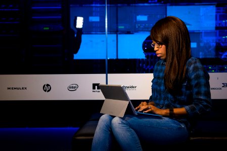 Photography Of Woman Using Ipad