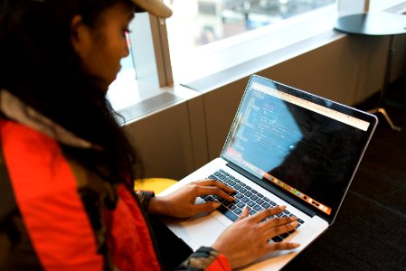 Woman Using Macbook Pro photo