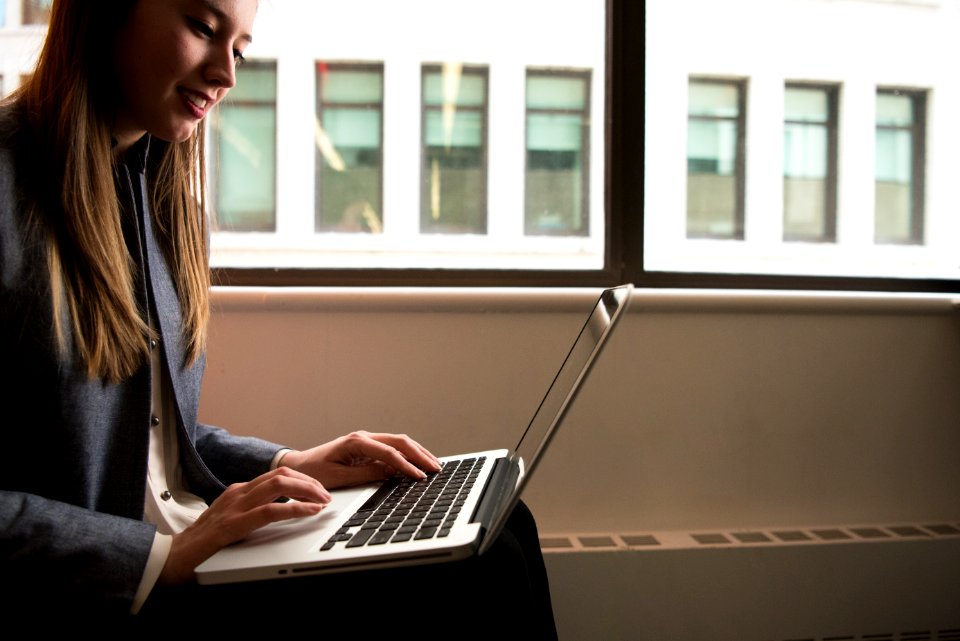 Photography Of Woman Using Laptop