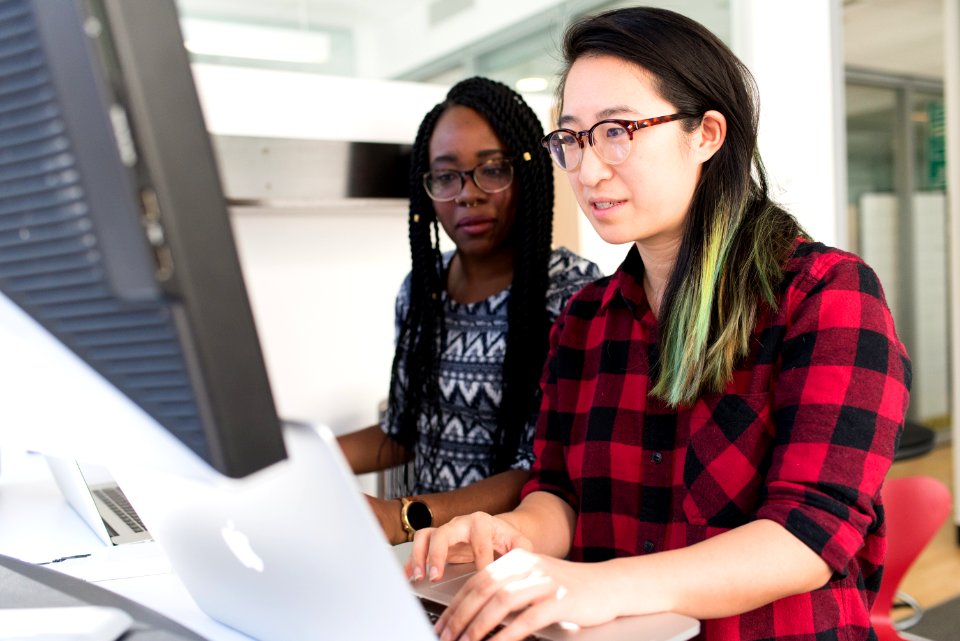 Woman Wearing Red And Black Checkered Blouse Using Macbook