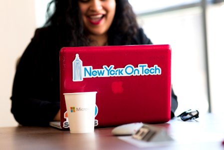 Selective Focus Phot Of Woman Typing On Red Macbook photo