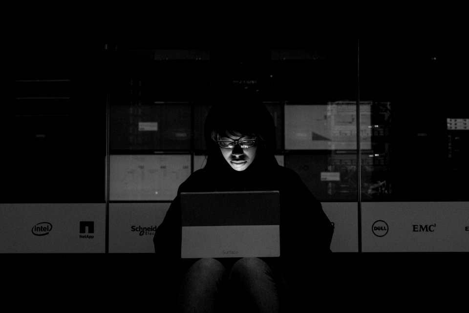Gray Scale Photograph Of A Woman Using A Laptop