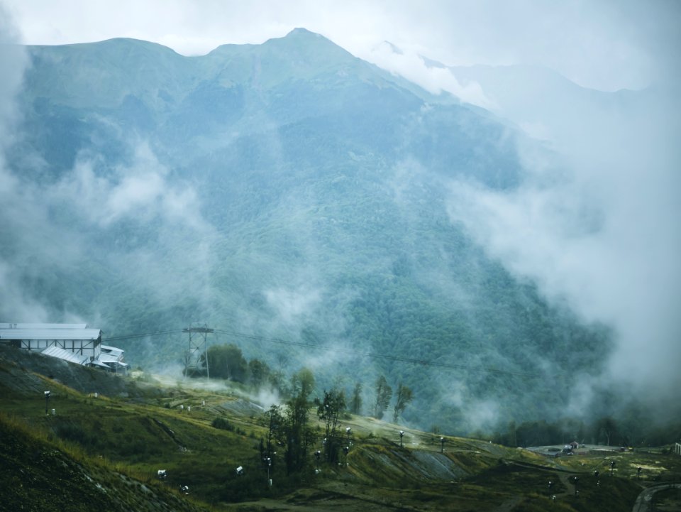 Green And Gray Foggy Mountain
